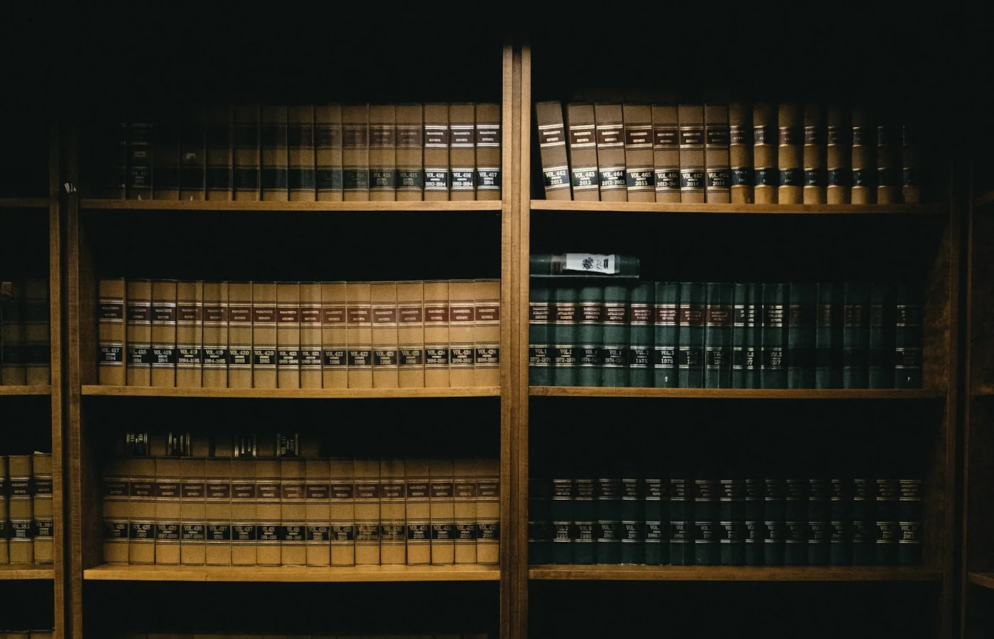 Shelves of bound law reports, numbered by volume and year.
