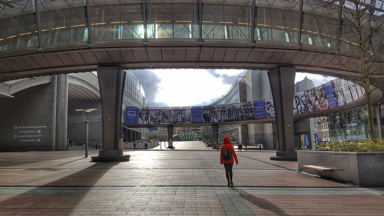 A pedestrian crossing the esplanade beneath the European Parliament building in Brussels.