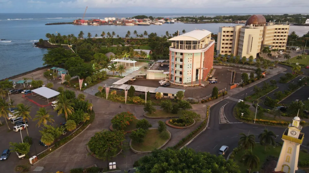 An aerial view of the Apia waterfront in Samoa, with office buildings, the harbour and the clock tower