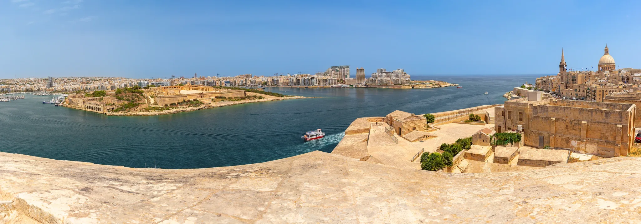 The Valletta peninsula seen from the city walls, Marsamxett Harbour and Fort Manoel sitting in the water.