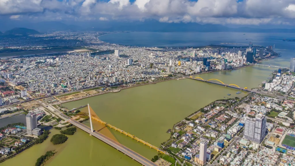 Da Nang from above, with the Han river, the cable-stayed Tran Thi Ly bridge, the Dragon bridge and the city stretching to the bay