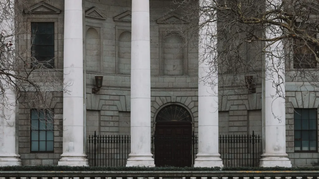 The colonnade and closed entrance of the Four Courts in Dublin, seen from the quay