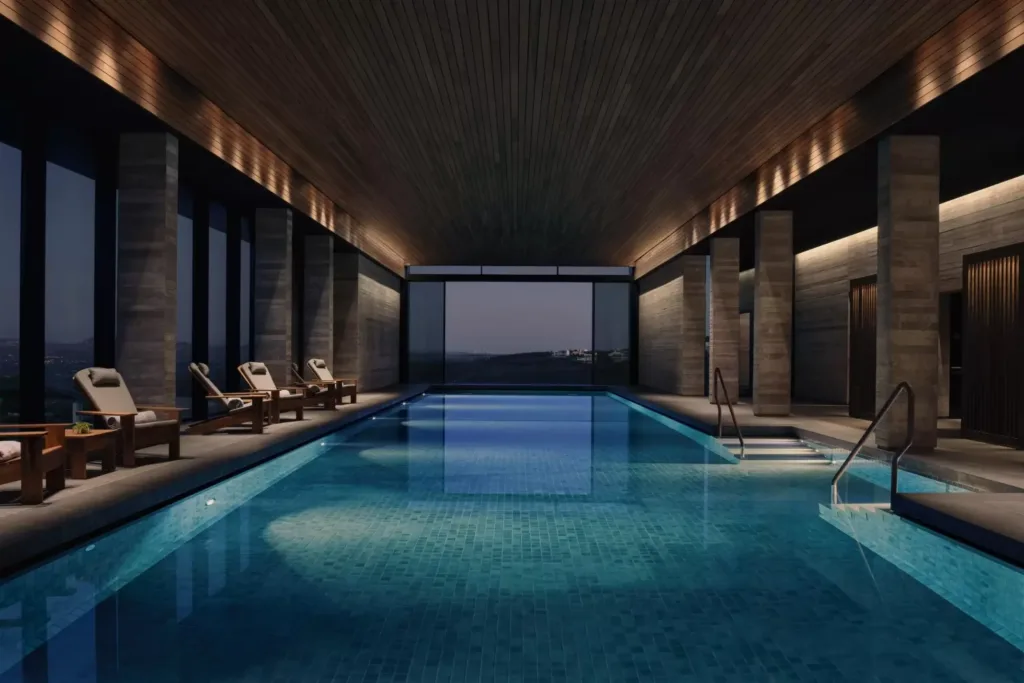 The spa's indoor heated pool under a timber ceiling