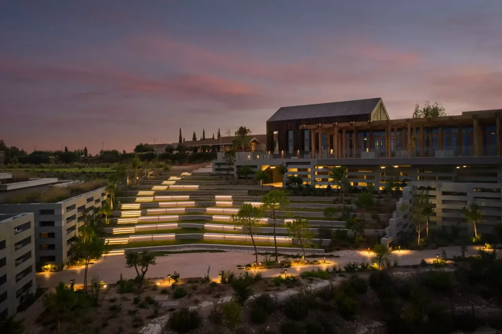Resort terraces and buildings lit at dusk