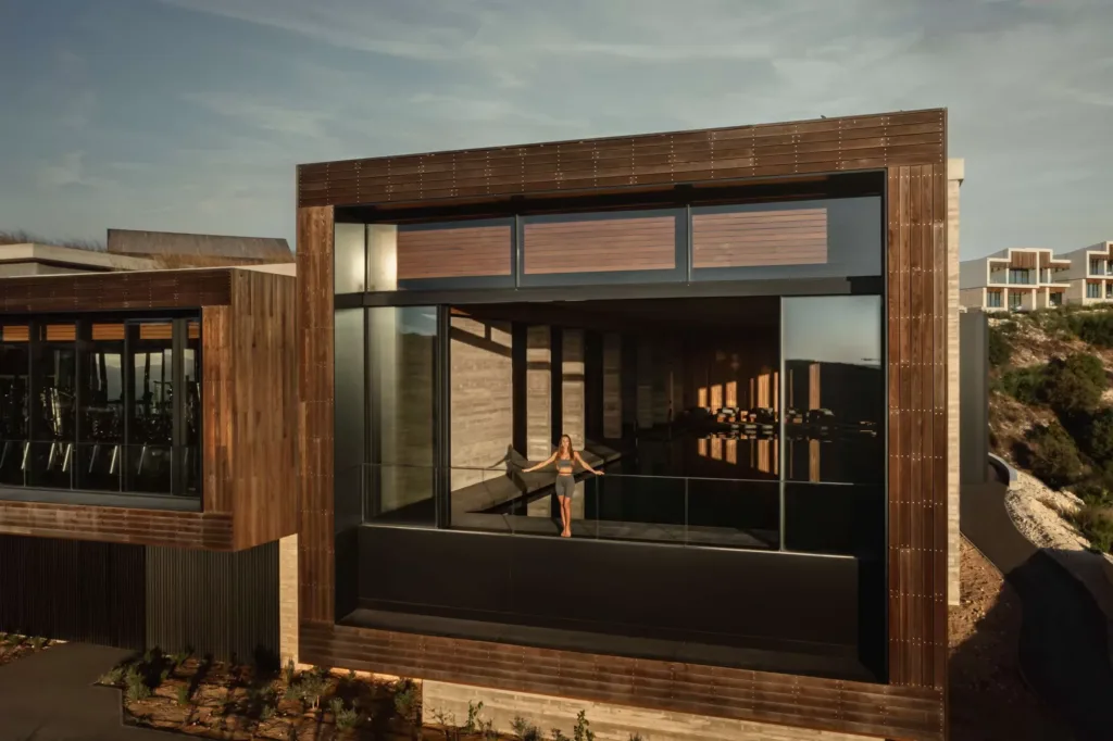Timber-clad spa exterior at dusk