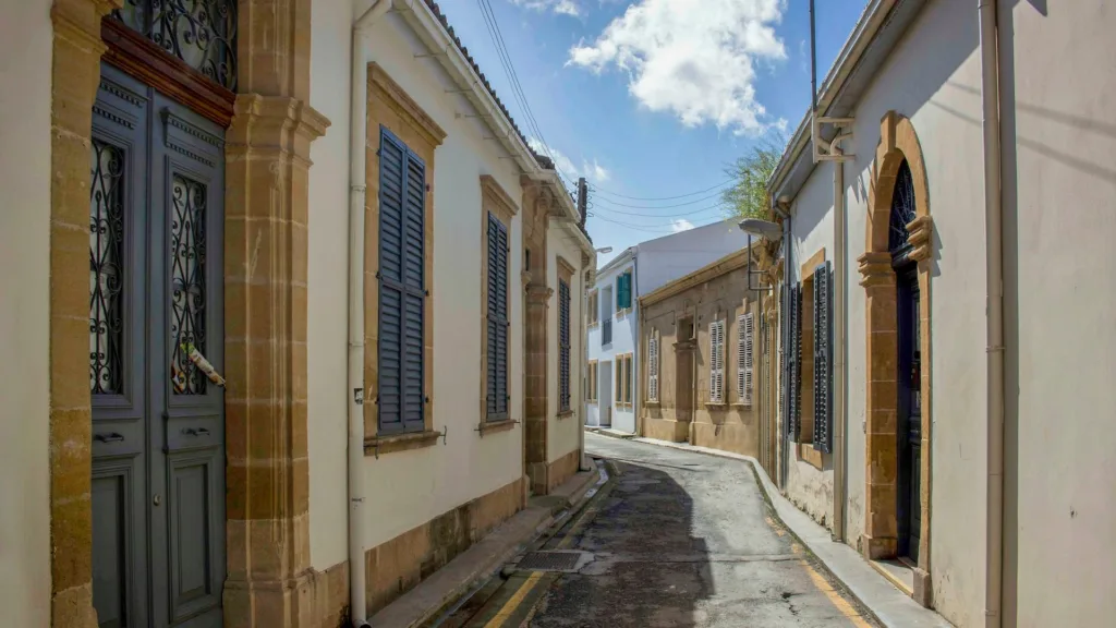 A narrow street of shuttered stone houses in the old town of Nicosia, Cyprus