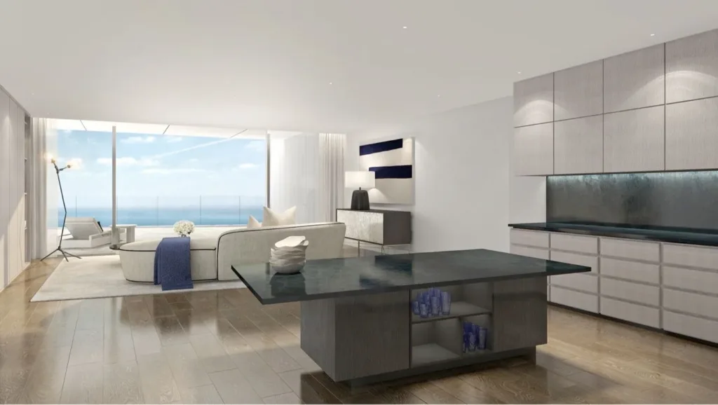 Open-plan kitchen and living area in an apartment with a sea view