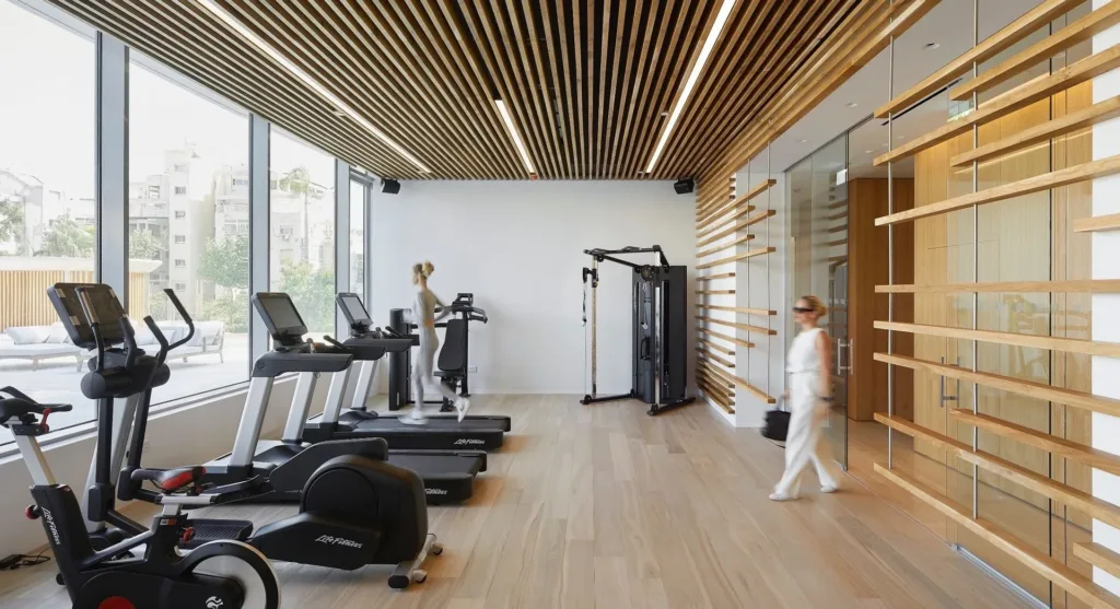 Residents' gym with a timber ceiling and treadmills