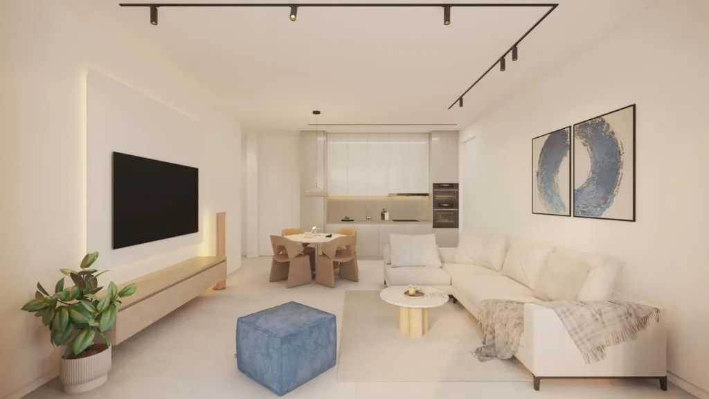 Phòng khách với sofa góc, tivi treo tường và bàn ăn phía sau