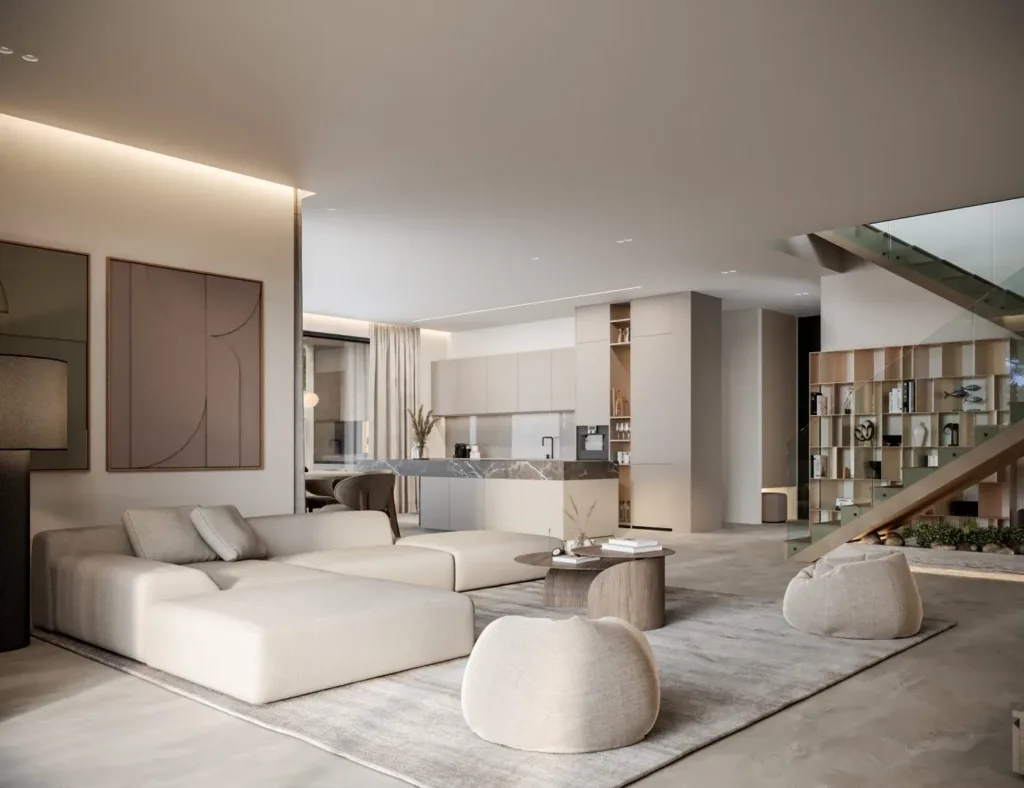 Phòng khách liền bếp với sofa trắng thấp và ghế đôn