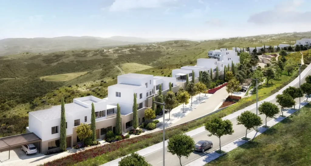 Ezousa Suites: row of white terraced homes along a tree-lined road in open countryside