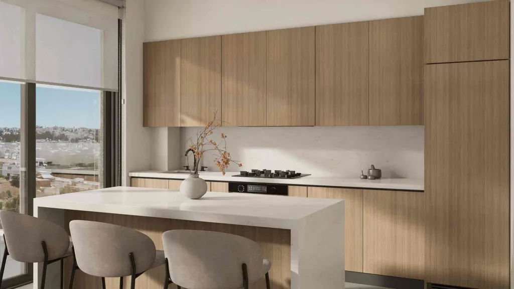 Phối cảnh bếp có đảo bếp và ghế quầy trong một căn hộ Galaxy Residences